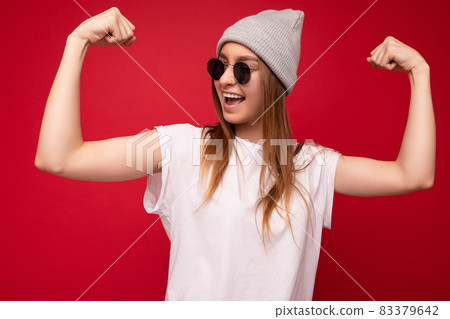 Portrait of young emotional positive happy beautiful dark blonde woman with sincere emotions wearing Portrait of young emotional positive happy beautiful dark blonde woman with sincere emotions wearing 83379642