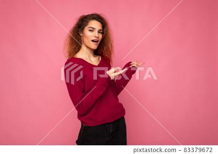 Photo of young happy positive amazed beautiful brunette wavy woman with sincere emotions wearing 83379672