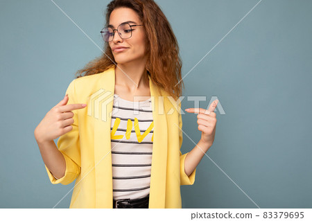 Photo of young positive sexy self-confident beautiful brunette curly woman with sincere emotions Photo of young positive sexy self-confident beautiful brunette curly woman with sincere emotions 83379695