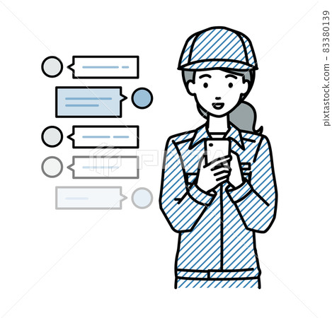A female worker who stands up and has a fun chat conversation on her smartphone A female worker who stands up and has a fun chat conversation on her smartphone 83380139