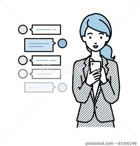 A woman in a suit who stands and chats happily on her smartphone A woman in a suit who stands and chats happily on her smartphone 83380146