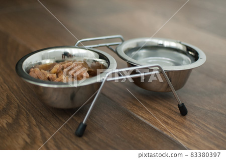 Wet food for dogs and cats in a bowl close up 83380397