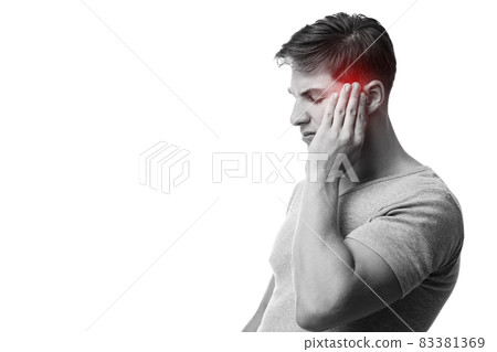 Sad young european guy suffering from headache, press hand to head, monochrome photo Sad young european guy suffering from headache, press hand to head, monochrome photo 83381369