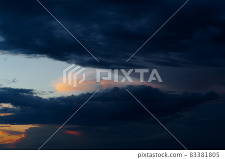 beautiful sunset sky, bright sunlight and silhouette of clouds as a background beautiful sunset sky, bright sunlight and silhouette of clouds as a background 83381805
