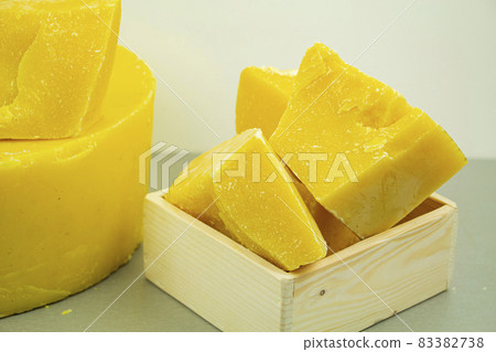 large pieces of natural beeswax, close-up, raw materials for candles, creams, soaps, eco-products. large pieces of natural beeswax, close-up, raw materials for candles, creams, soaps, eco-products. 83382738