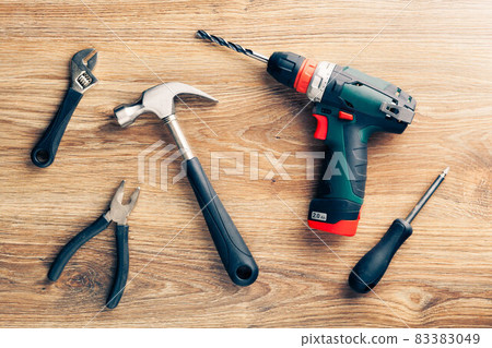 work tools on wooden background 83383049