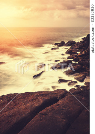 Rocky beach at sunset, color toning applied, Sri Lanka. Rocky beach at sunset, color toning applied, Sri Lanka. 83383930