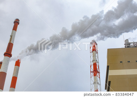 Paper mill chimneys and smoke Paper mill chimneys and smoke 83384047