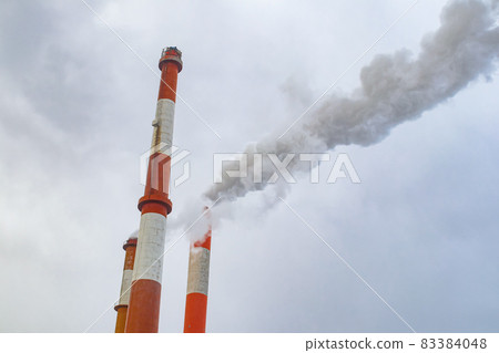 Paper mill chimneys and smoke 83384048