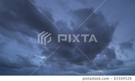 Dramatic dark blue clouds sky with thunder storm and rain at night. Abstract nature landscape background. 83384526