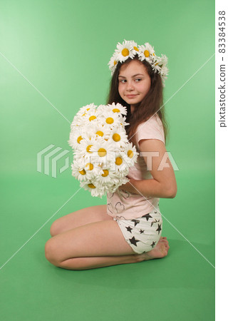 Beautiful girl with chamomile wreath Beautiful girl with chamomile wreath 83384538