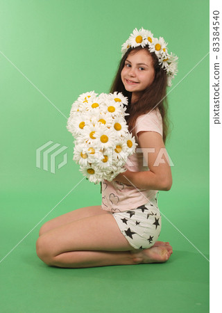Beautiful girl with chamomile wreath Beautiful girl with chamomile wreath 83384540