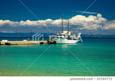 Ship on blue paradise water of Toroneos kolpos gulf, Halkidiki, Greece Ship on blue paradise water of Toroneos kolpos gulf, Halkidiki, Greece 83384772