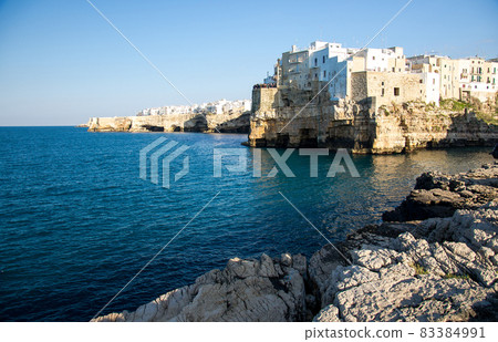 White buildings on grottos and cliffs in the town of Polignano a mare in Puglia White buildings on grottos and cliffs in the town of Polignano a mare in Puglia 83384991