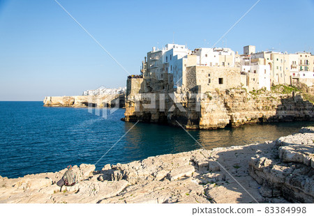 White buildings on grottos and cliffs in the town of Polignano a mare in Puglia White buildings on grottos and cliffs in the town of Polignano a mare in Puglia 83384998