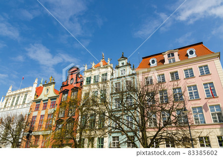 Facade of beautiful typical colorful buildings, Gdansk, Poland 83385602