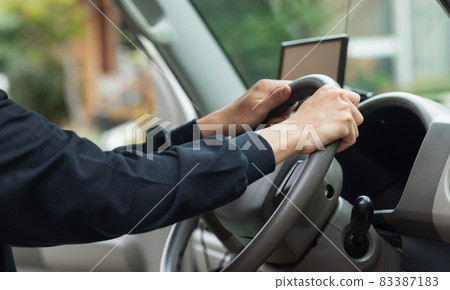 Driver holding the wheel Driver holding the wheel 83387183