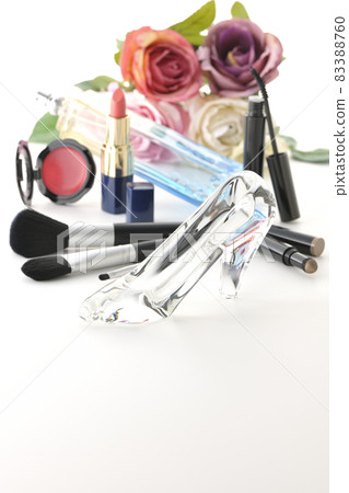 Photographed glass shoes, lipstick, blush, mascara, perfume, brush and bouquet on a white background Photographed glass shoes, lipstick, blush, mascara, perfume, brush and bouquet on a white background 83388760