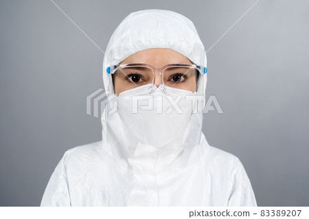 doctor in protective PPE suit wearing face mask and face shield protection from coronavirus(covid-19) pandemic 83389207