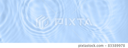 The surface of light on the blue transparent swimming pool water with water circles. Trendy abstract wavy background. Water waves in sunlight banner. Long banner with copy space The surface of light on the blue transparent swimming pool water with water circles. Trendy abstract wavy background. Water waves in sunlight banner. Long banner with copy space 83389978