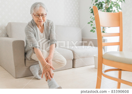 Elderly woman with ankle pain Elderly woman with ankle pain 83390608