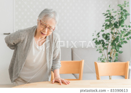 Elderly woman with a backache Elderly woman with a backache 83390613