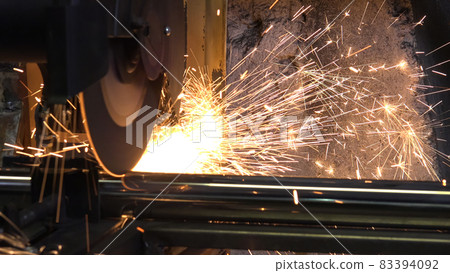 Close-up photo of working circular saw with sparks Close-up photo of working circular saw with sparks 83394092