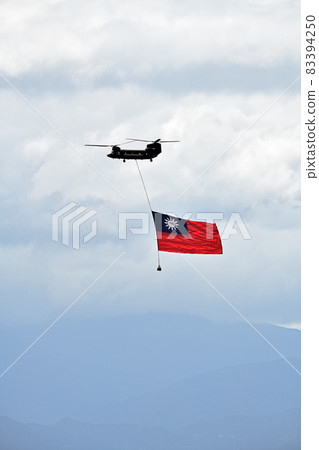 Military helicopter flying the Taiwanese flag on Taiwan National Day 83394250
