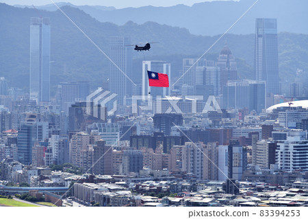 Military helicopter flying the Taiwanese flag on Taiwan National Day 83394253