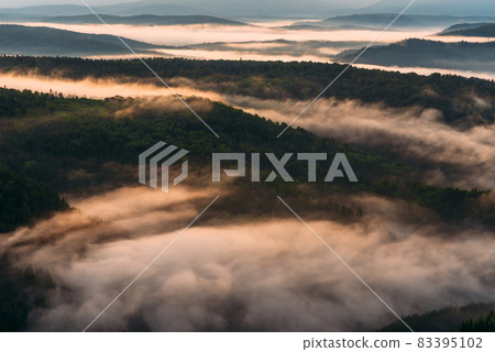 Fog in the mountains at sunrise. Morning fog in the mountains at dawn. Clouds in the mountains. Morning fog after rain. Mountains at dawn. Milk rivers. Copy space Fog in the mountains at sunrise. Morning fog in the mountains at dawn. Clouds in the mountains. Morning fog after rain. Mountains at dawn. Milk rivers. Copy space 83395102