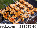 Barbecue skewers with grilled champignon mushroom kebab in a brazier 83395340