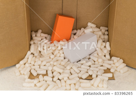 Cardboard box with styrofoam filler for safe packaging. Gift package Cardboard box with styrofoam filler for safe packaging. Gift package 83396265
