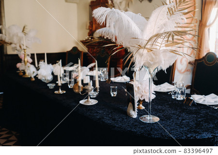 decorated festive table for a wedding evening in an old castle decorated festive table for a wedding evening in an old castle 83396497