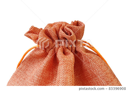 Front view of orange red fabric drawstring gift bag isolated on white background with clipping path. 83396908