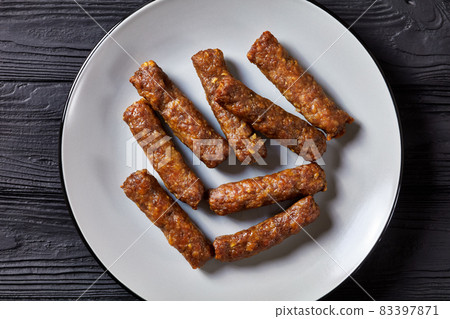 cevapcici, grilled balkan sausages on a plate 83397871