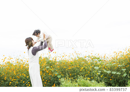 Cute parents and children taking a walk Cute parents and children taking a walk 83399737