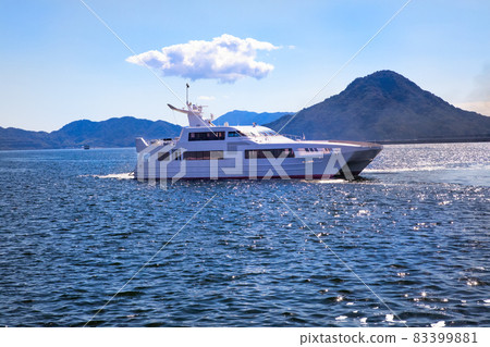 It is the scenery of the high-speed ferry that connects the Seto Inland Sea. You can see the islands in the distant view. -Four It is the scenery of the high-speed ferry that connects the Seto Inland Sea. You can see the islands in the distant view. -Four 83399881