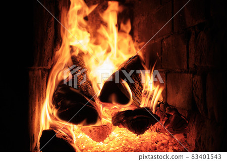 A Fire Is Burning In A Brick Village Stove. Flames, Hot Coals and Logs. 83401543