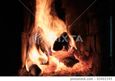A Fire Is Burning In A Brick Village Stove. Flames, Hot Coals and Logs. A Fire Is Burning In A Brick Village Stove. Flames, Hot Coals and Logs. 83401545