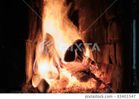 A Fire Is Burning In A Brick Village Stove. Flames, Hot Coals and Logs. 83401547
