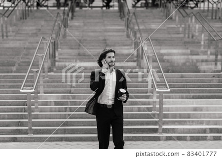 Portrait of an handsome businessman in the city. Portrait of an handsome businessman in the city. 83401777