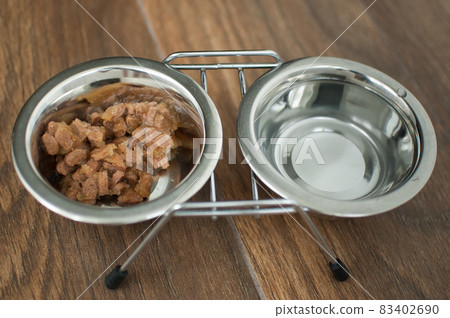 Wet food for dogs and cats in a bowl close up Wet food for dogs and cats in a bowl close up 83402690