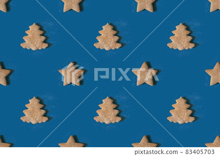 Pattern of gingerbread in the shape of stars and Christmas trees 83405703