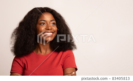 Portrait Of Smiling Young Black Lady Looking Away With Excitement Portrait Of Smiling Young Black Lady Looking Away With Excitement 83405813