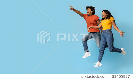 Thrilled african american couple looking at copy space Thrilled african american couple looking at copy space 83405937