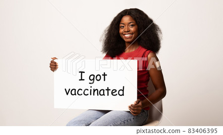 Smiling Black Woman Holding Motivational Placard With I Got Vaccinated Inscription 83406395