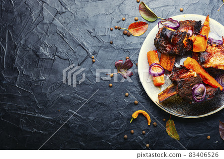 Grilled meat with pumpkin,space for text Grilled meat with pumpkin,space for text 83406526