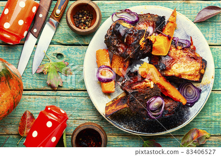 Piece of baked beef ribs 83406527