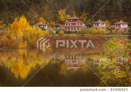 Autumn landscape with lake and houses, Bulgaria 83406925