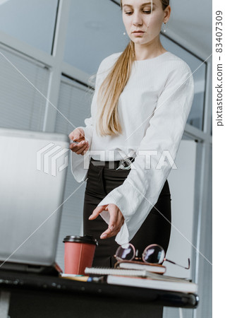 Young business woman, speaker coach drawing on white board and having online meeting in office. Focused team leader businesswoman, project manager working with white board Young business woman, speaker coach drawing on white board and having online meeting in office. Focused team leader businesswoman, project manager working with white board 83407309